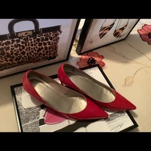 Red patent wedge shoes